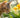 A tabby cat nibbling on a daffodil leaf in a garden