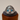 A silver ring featuring a detailed cat's head with a traditional Indian headdress and blue glass gem eyes.
