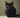 A Black Bombay Cat laying on bed.