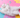 a white cat laying on belly 