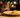An elegant cat sniffing a plate of pasta 