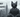 A sleek and stylish grey cat sits confidently, wearing silver aviator sunglasses and a perfectly tailored grey suit.