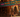 Vibrant animated bazaar with colorful stalls displaying name tags in Arabic and English