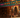 Vibrant animated bazaar with colorful stalls displaying name tags in Arabic and English