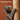A stylish cat scratching post with a hanging rope toy and multiple textures