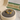 Gold ring in a jewelry box with 'Veline Fancy' packaging in the background