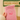 Pink fleece pouch with an embroidered design held by a person, with a blurred background.