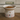 Cat food bowl with cartoon cat designs on a wooden surface