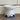 White ceramic bowl with blue patterns on a wooden surface