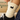 White sock with a black cat design worn by a person, with a blurred background.