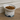 Ceramic bowl with pet food on a wooden floor