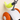 Close-up of a modern cat toy shaped like a mushroom, featuring a white body, orange cap, and a bright yellow-green fuzzy tail, with a gray plastic pole and hanging loop.