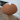 Brown rope cat toy shaped like a mushroom on a blurred background