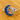 Silver ring with blue gemstones shaped like a crescent moon and a cat on a wooden surface