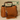 Brown leather handbag with a tassel charm on a beige background