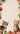 Two playful cats in a festive Christmas setting, one on the left and one on the right.
