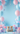Two kittens sitting among balloons and decorations on a light blue background