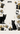 Pattern of black cats, gold bows, and presents on a white background