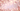 Pink flower petals on a soft pink background with bokeh effect