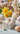 Decorative gift box with Easter eggs and flowers on a light surface