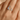 Silver ring with moon and rabbit design on a hand