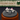 Silver ring with pink accents on a gray cushion, branded 'Feline Fancy' in the background.