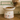 Cat eating from a white bowl with cartoon cat designs on a wooden surface, with 'Feline Fancy' branding in the background.