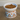 Decorative pet bowl with pet food on a wooden floor