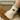 White sock with a black cat design worn by a person, with 'Feline Fancy' sign in the background.
