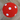 Red ball with white dots on a wooden floor