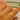 Gold ring on a finger with a blurred background