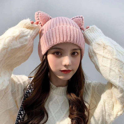 Add a touch of feline flair to your outfit with the adorable and cozy Cat Ears Hat