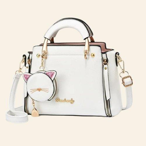 Kitty Charm Handbag featuring a playful design with a cute cat charm, perfect for adding a fun and whimsical touch to your outfit