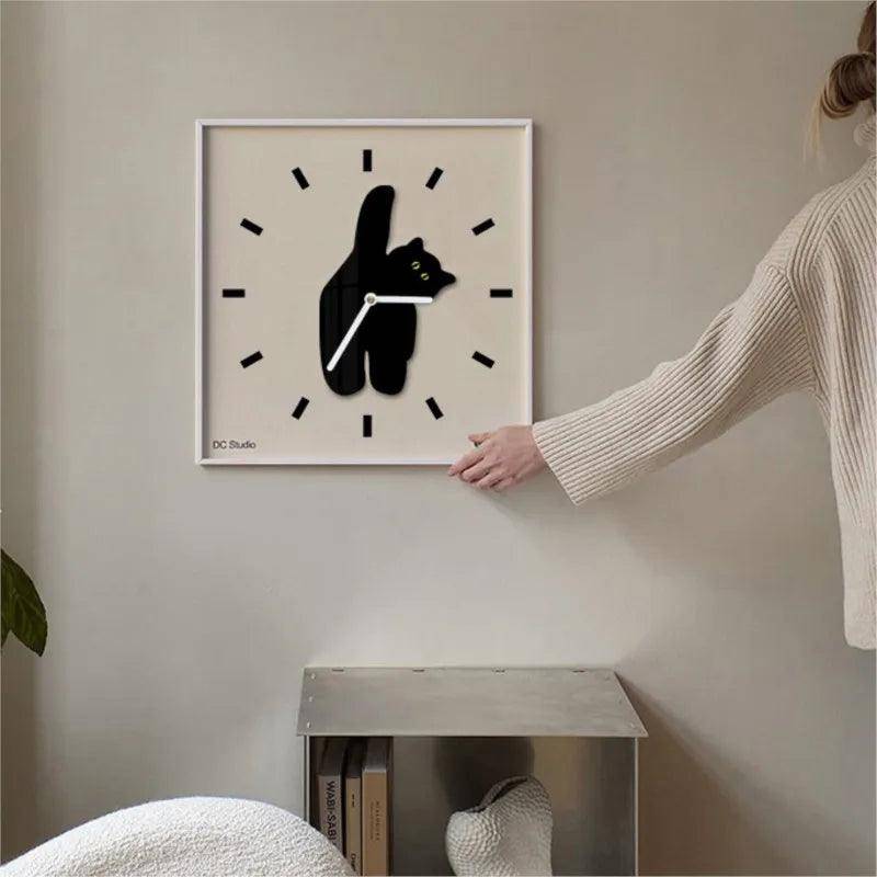 Stylish Black Cat Wall Clock featuring a sleek and modern feline design.