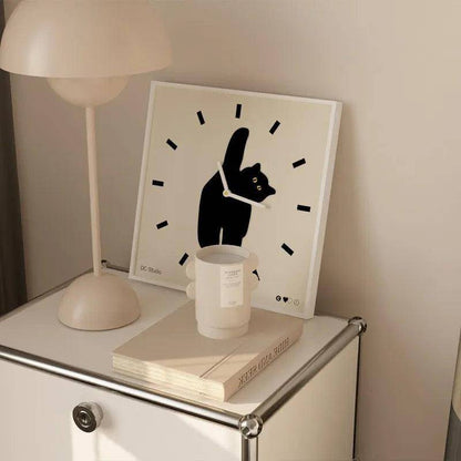 Unique Black Cat Wall Clock with a whimsical cat-inspired motif.