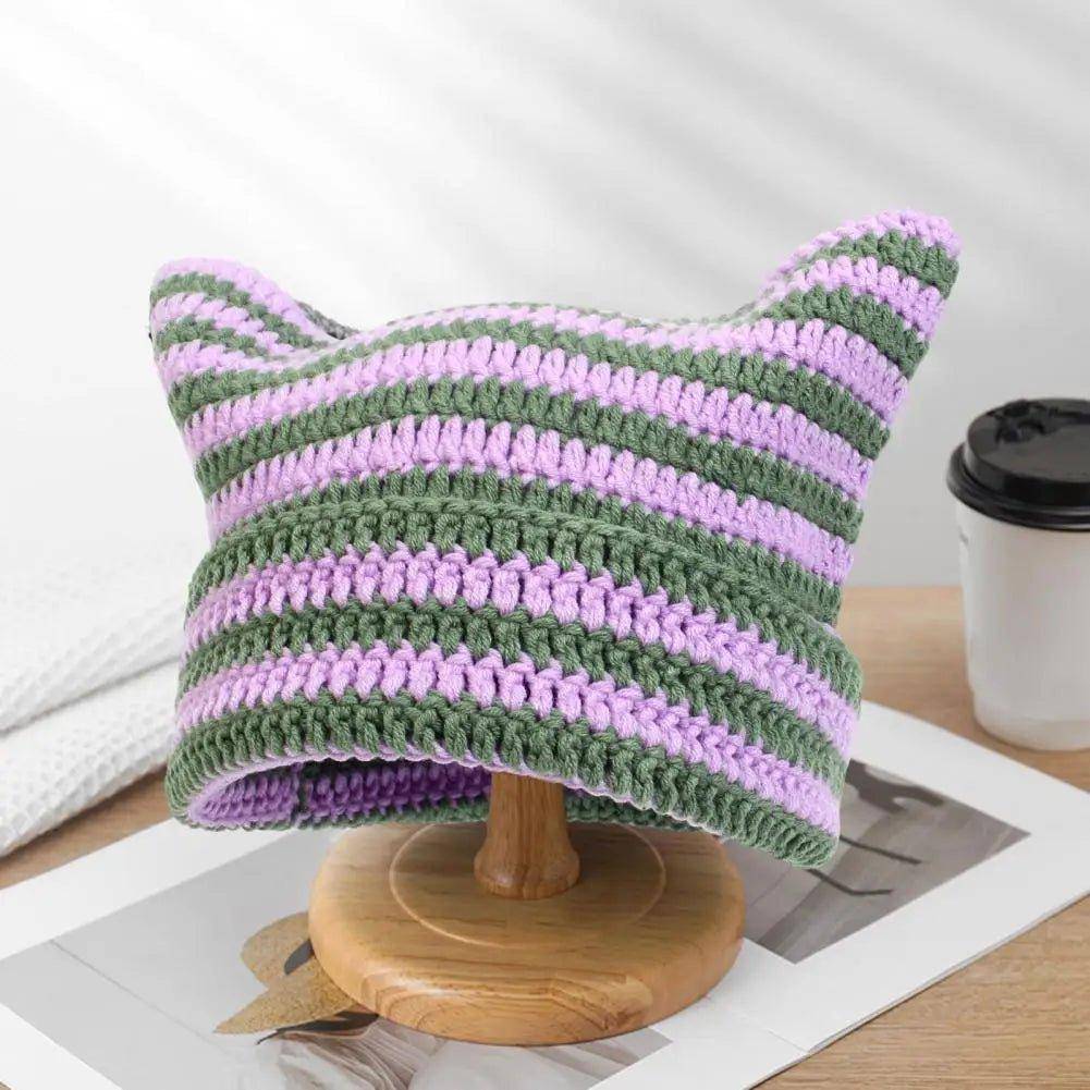 The Snuggle Cat Hat adds a cute, cozy touch to your winter look, perfect for snuggling up on cold days