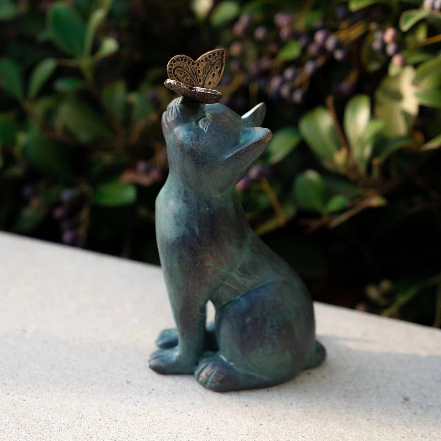 Add a whimsical touch to any yard with this charming Black Cat Garden Statue