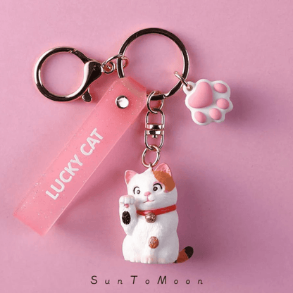 Charming White Cat Keychain with a polished finish, perfect for cat lovers.