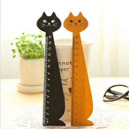 The Wooden Cat Ruler combines practicality with a cute cat motif, ideal for school or office use