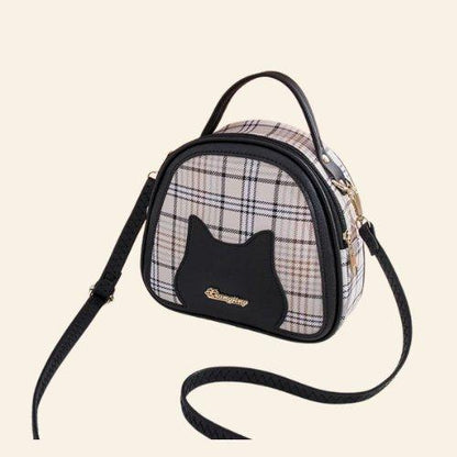 Perfect for cat lovers seeking a chic, tranquil accessory, the Serenity Cat Bag adds harmony to your look