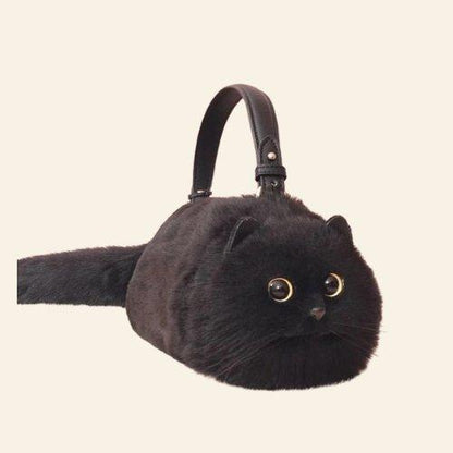 This versatile Felix Cat Bag is ideal for any occasion, bringing a joyful and charming element to your wardrobe