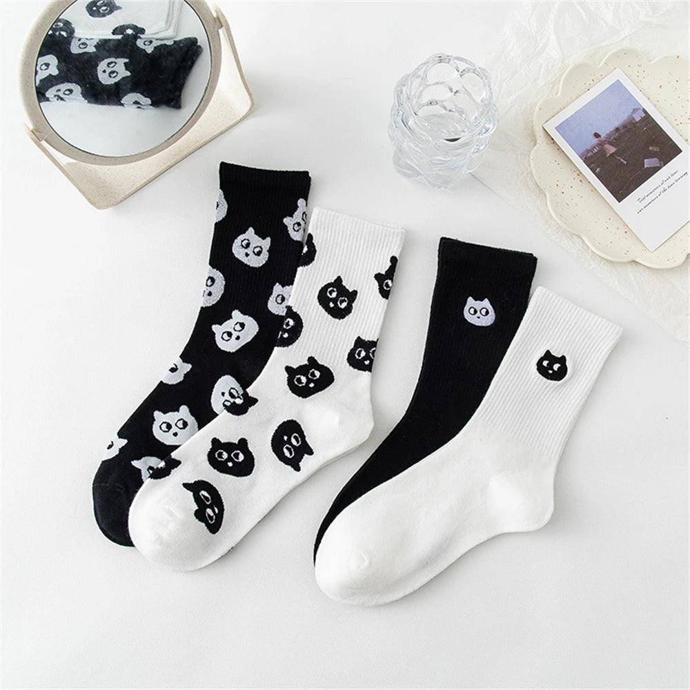 Black Cat Socks designed to be versatile, adding personality to both casual and formal outfits