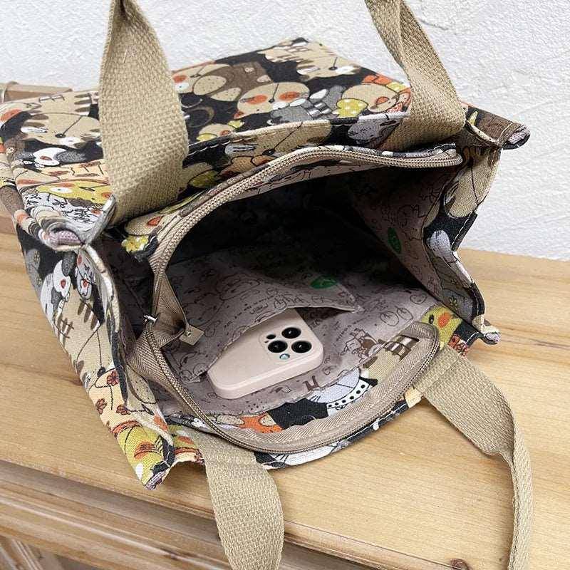 Perfect for cat lovers, the Cute Cat Tote Bag adds personality and charm to your outfit