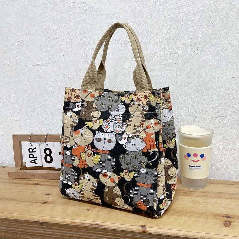 Crafted with high-quality materials, the Cute Cat Tote Bag is durable and spacious