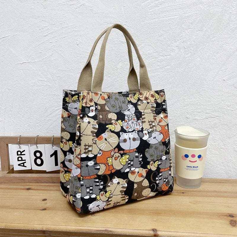 This Cute Cat Tote Bag is a must-have for cat enthusiasts who enjoy both fashion and practicality