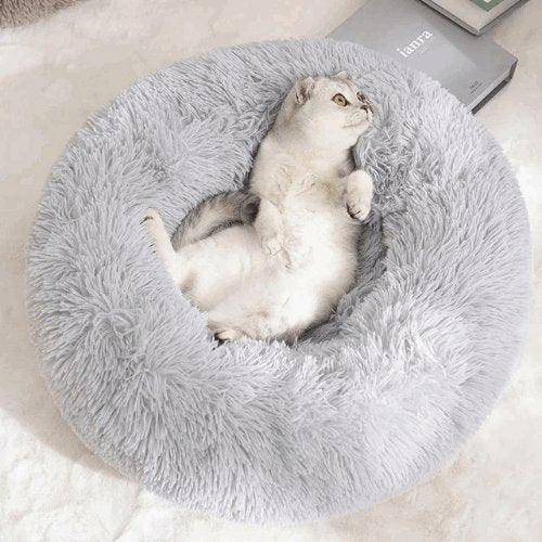 Cat Donut Bed featuring a cozy, circular design that provides a warm, soft space for your cat to curl up and relax