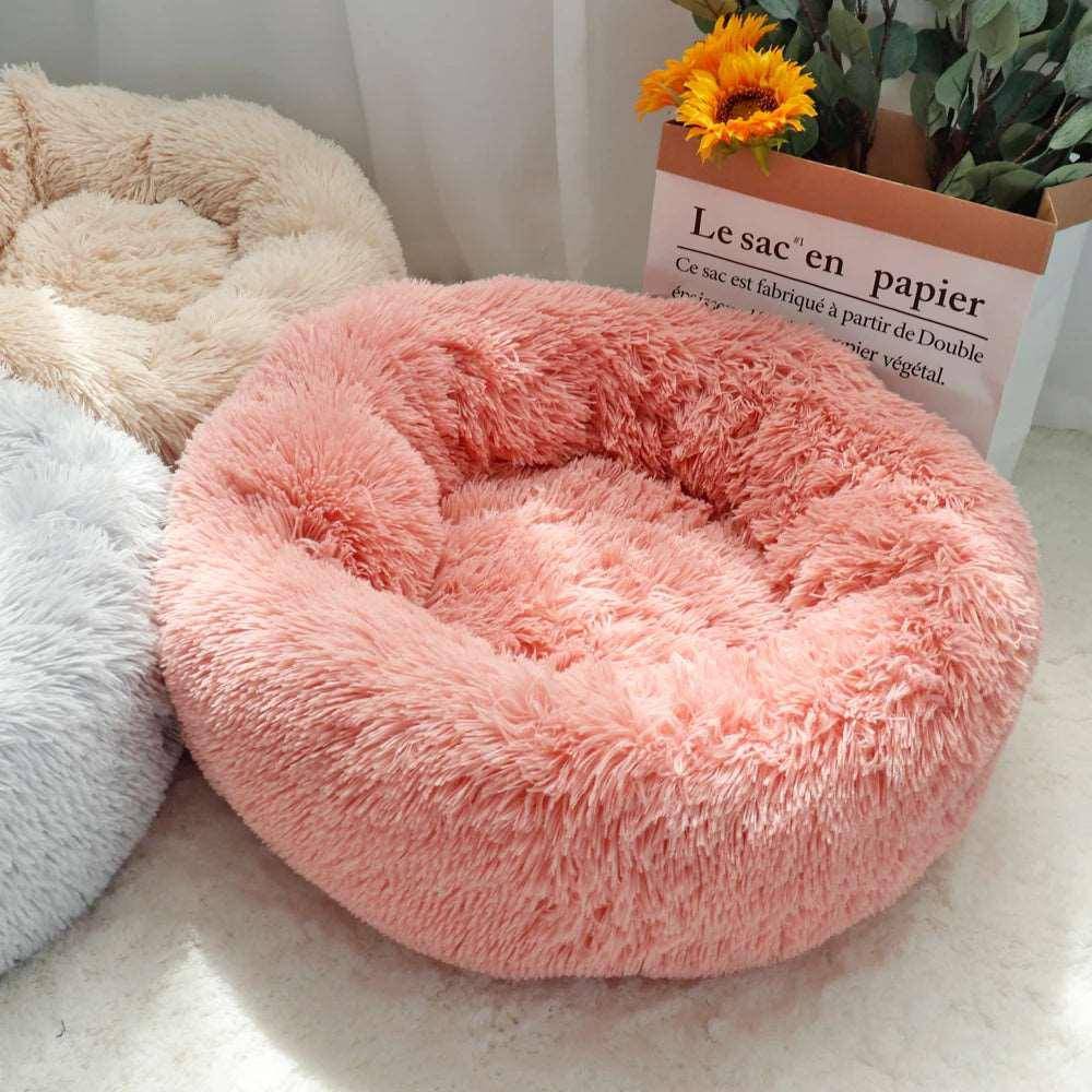 The Cat Donut Bed combines a raised edge with a soft, cushioned center, offering perfect support for your cat’s head and neck