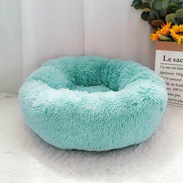 The Cat Donut Bed is ideal for cats of all sizes, offering a soft and supportive resting spot for every cat to enjoy